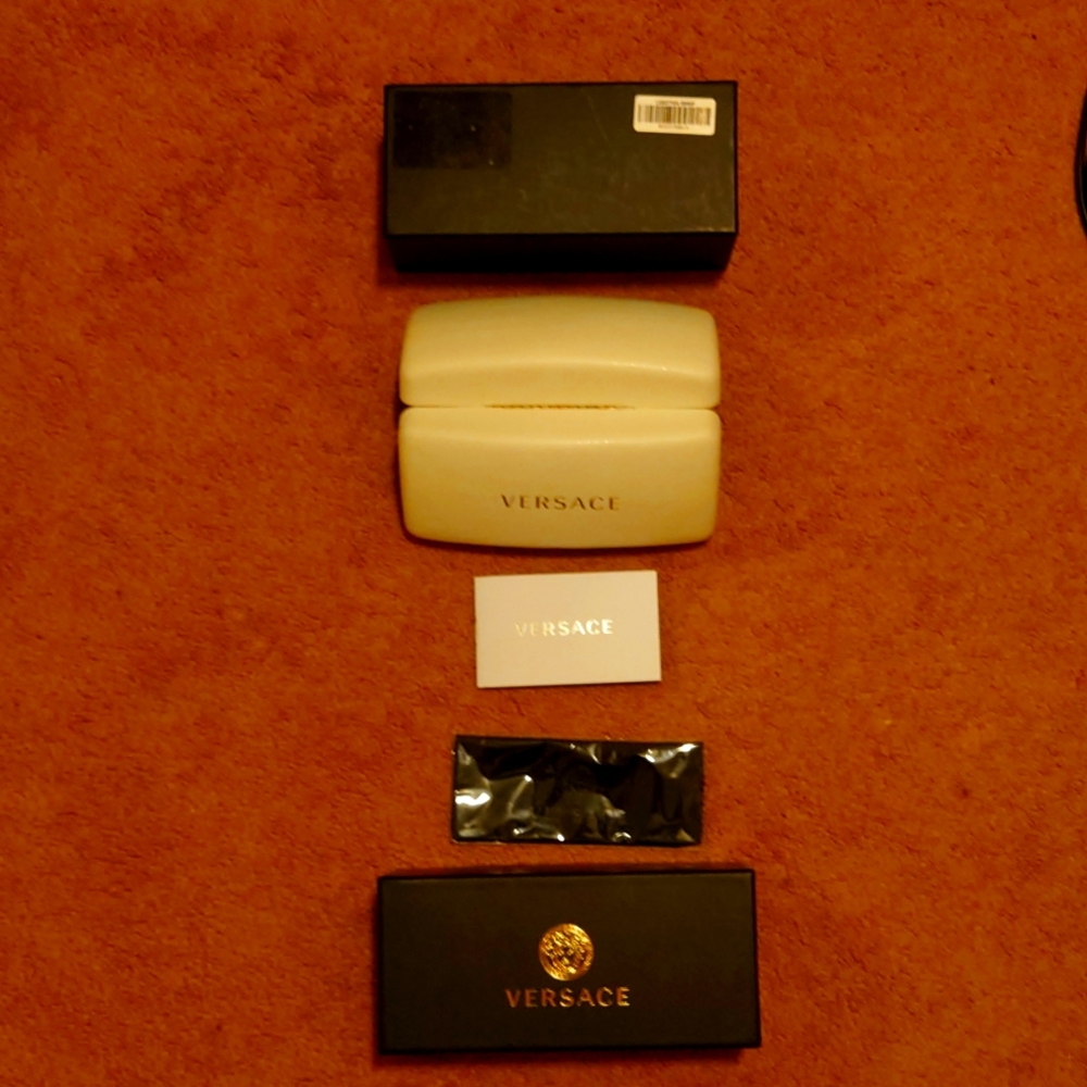 Versace glass case w/cloth and printed material